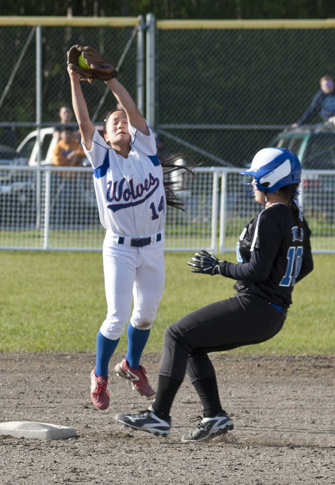 Thunder Mountain's Alondra Echiverri makes it to second just ahead of Sitka shortstop Minh Iwamoto Friday, May 20, in Sitka.