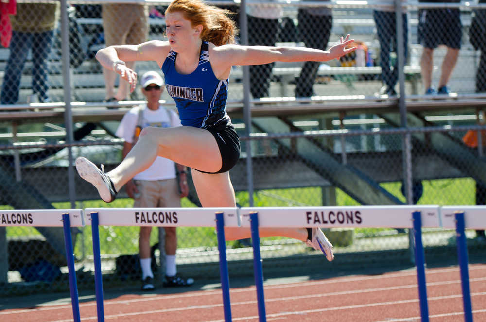 Thunder Mountain's Naomi Welling leads in the 100-meter hurdle during Saturday moring's Regional meet at Thunder Mountain Field. Naomi won the event.
