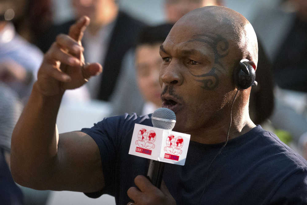 Former heavyweight boxing champion Mike Tyson speaks during a panel discussion held before the 2016 IBF World Championship Bout at the National Tennis Center in Beijing, Wednesday, May 25, 2016. (AP Photo/Mark Schiefelbein)