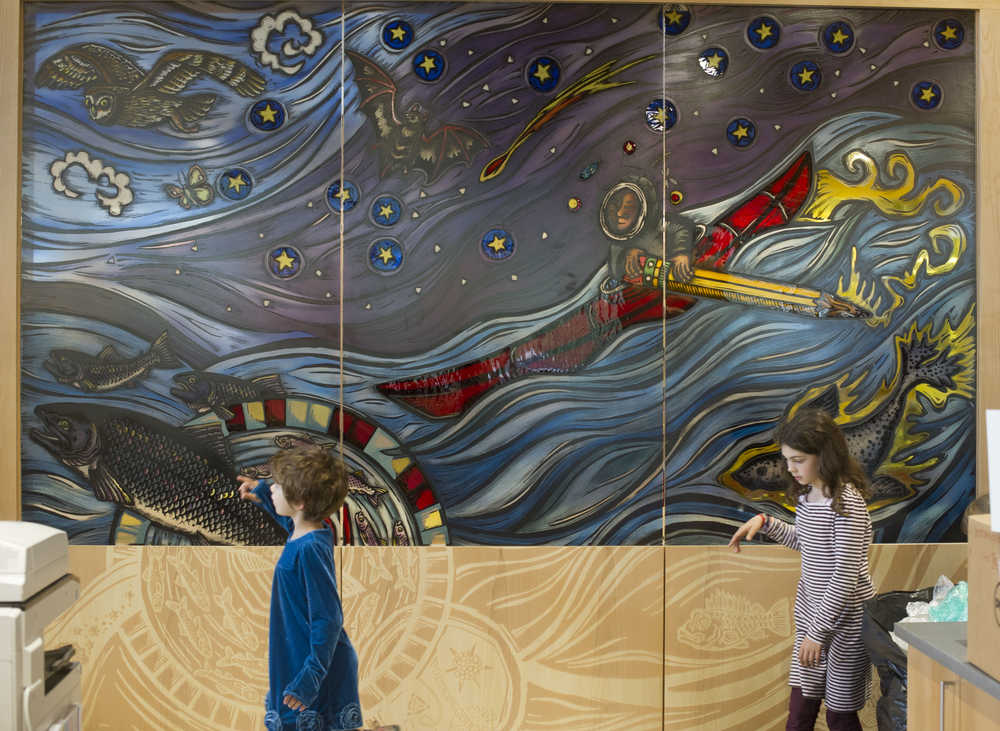 Sasha Morrison, 8, left, and her sister, Anita, 10, view a portion of artist Evon Zerbetz's glass dividing wall in the Father Andrew P. Kashevaroff State Library, Archives, and Museum. The children were taking part of a family day tour of the new facility. The building opens to the public on Monday, June 6.