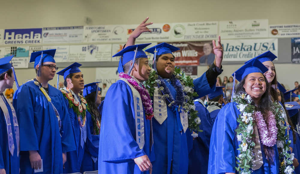 Students await the start of the graduation ceremony Sunday at Thunder Mountain High School.