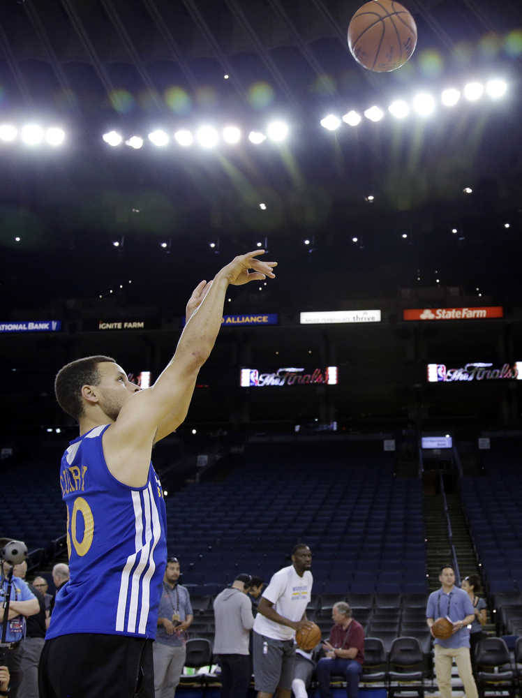 Golden State Warriors' Stephen Curry shoots during NBA basketball practice Wednesday, June 1, 2016, in Oakland, Calif. The Warriors host the Cleveland Cavaliers in Game 1 of the NBA finals on Thursday. (AP Photo/Marcio Jose Sanchez)