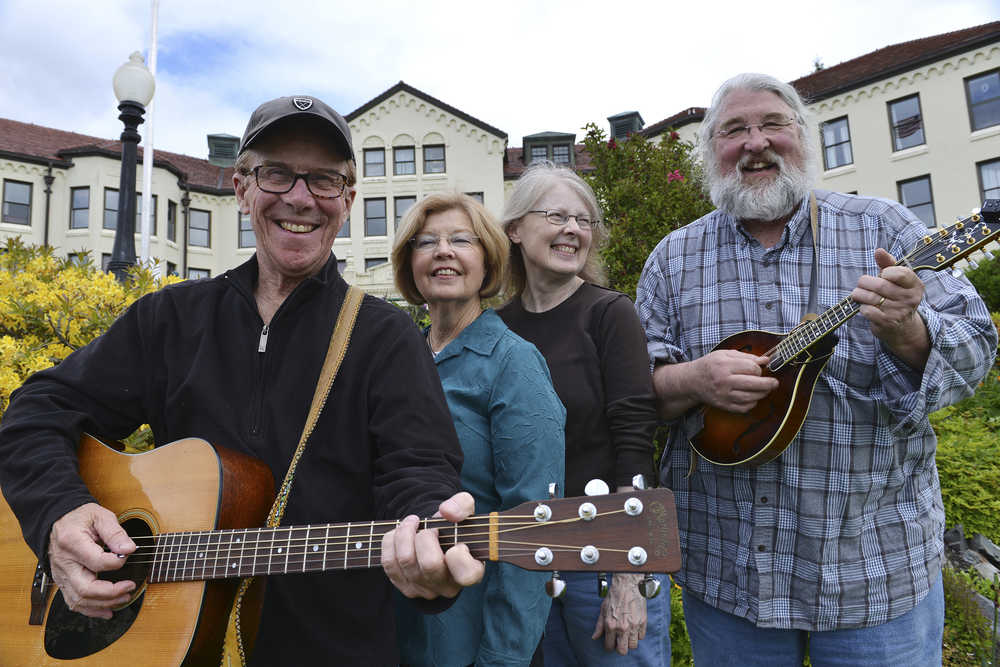 In this June 2 photo, from left, Mike Pierce, Candy Pierce, Julie Schmitts and Ted Howard get together outside the Pioneers Home in Sitka. Their band, Cornsilk, had a reunion over the weekend after a four decade hiatus.