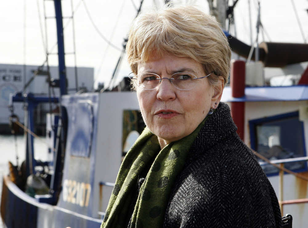 In this March 2, 2010 file photo, National Oceanic and Atmospheric Administration chief Jane Lubchenco looks out from the waterfront as she speaks to fisherman in Gloucester, Massachusettes. Nearly 400 scientists are urging President Obama to eliminate the possibility of Arctic offshore drilling in the near future by taking Arctic waters out of the next federal offshore lease sale plan. The 388 scientists include Lubchenco, Obama's former administrator of NOAA. The Interior Department is collecting public comment through Thursday, June 16, 2016, on the proposed 5-year oil and gas leasing program, which would cover 2017 to 2022.