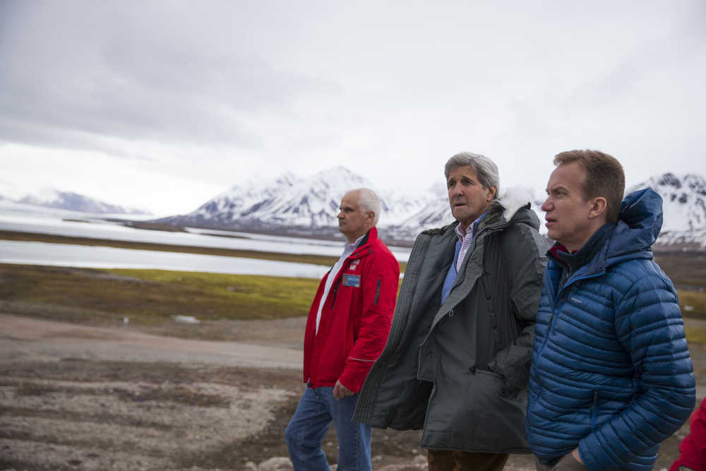 U.S. Secretary of State John Kerry, center, and Norwegian Foreign Minister Borge Brende, right, tour Ny-Alesund Village, the northernmost civilian settlement in the world, before visiting Blomstrand Glacier, on Thursday.