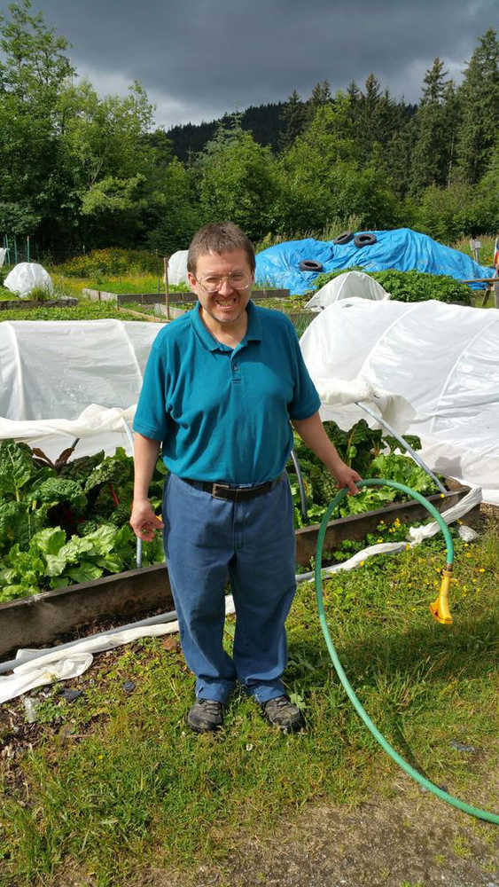 Jim Merculief working at the REACH community garden plot.