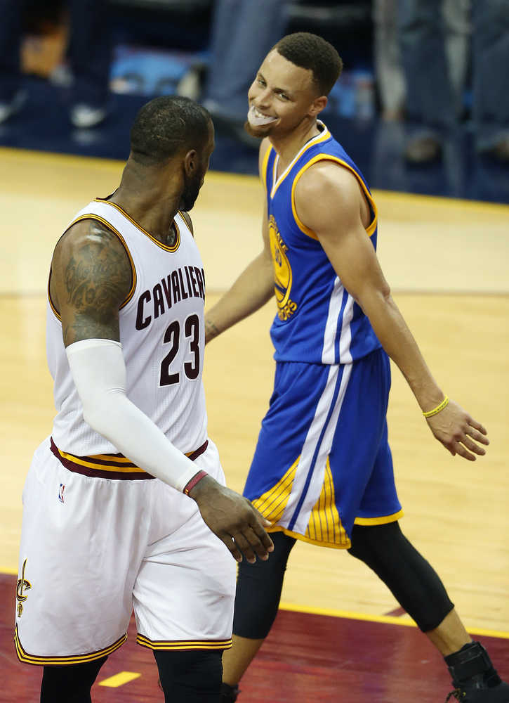 Cleveland Cavaliers forward LeBron James (23) and Golden State Warriors guard Stephen Curry (30) during the second half of Game 6 of basketball's NBA Finals in Cleveland, Thursday, June 16, 2016. (AP Photo/Ron Schwane)