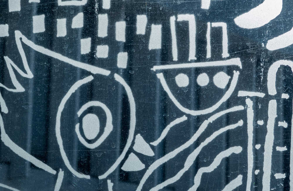 Urban etchings at a bus stop