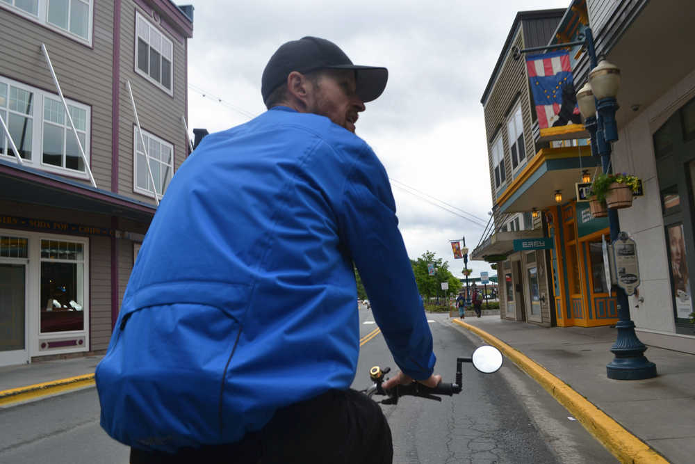 Kris McClure sits astride one of his three pedicabs. McClure started Alaska Pedicab last fall. Now in its first season, the business offers shuttle rides and downtown tours to locals and cruise passengers alike.
