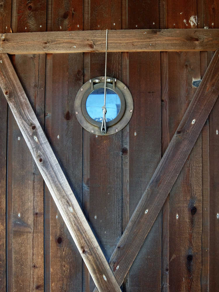 A porthole to the sky (a shed door.) Photo by Brooke Daly.