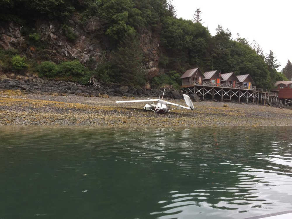 A Cessna 206 floatplane owned and piloted by Alaska Dispatch News owner Alice Rogoff sits on the beach off Ismailof Island in Halibut  Cove on Sunday night.