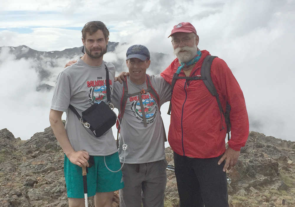 In this June 25 photo, Forest Wagner, left, is shown after hiking a mountain. He survived a brown bear attack in April 2016.
