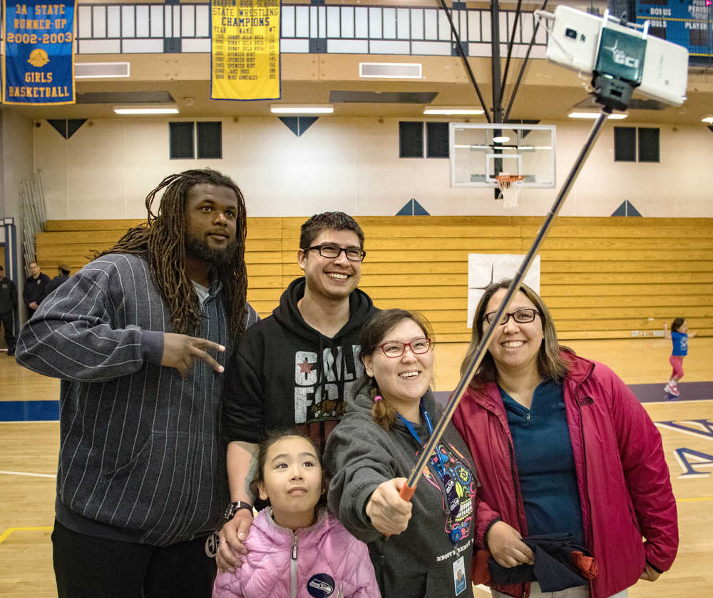 Seattle Seahawks offensive tackle Terry Poole poses for a photo while visiting Barrow High School on Wednesday.