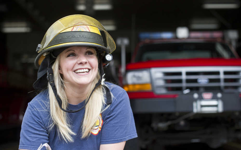 Kristi Asplund,a volunteer firefighter at the Douglas Station, lives at the station in exchange for maintaining ready status of equipment and driving the engine to fires.