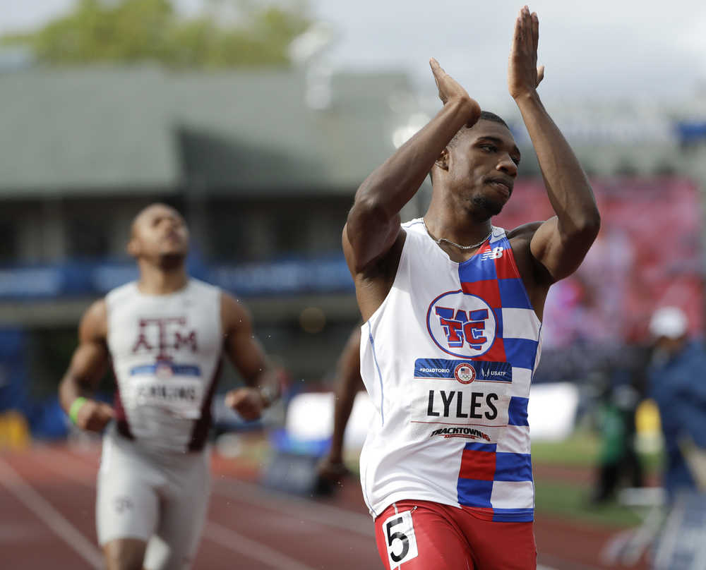 Noah Lyles celebrates after winning his heat during the semifinals in the men's 200-meter run Friday at the U.S. Olympic Track and Field Trials.