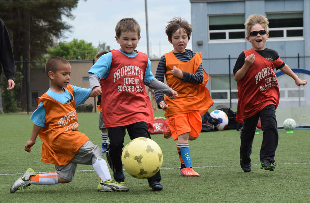 Young soccer players enjoy a game of three on three at a Juneau Soccer Club day camp. Registration for this week's camps are still open.