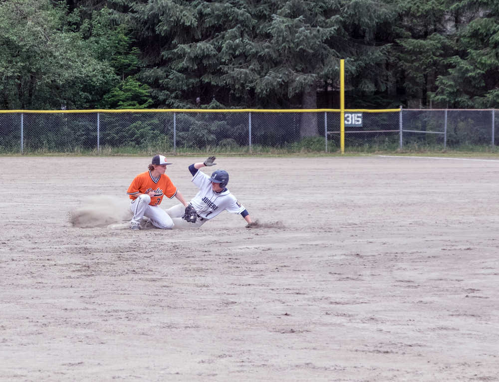 Juneau Post 25's Finn Collins steals second base from West Anchorage's Mitch Goudreau during Saturday's match.