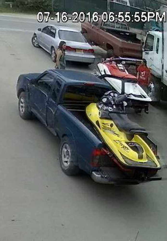 A still image from an auto lot's surveillance camera show's a man and woman taking a part from a Jet Ski without paying for it, police said. The Juneau Police Department is asking the community to help them locate the pair, the dented dark blue truck they pulled up in or the yellow Jet Ski the pair is believed to own.