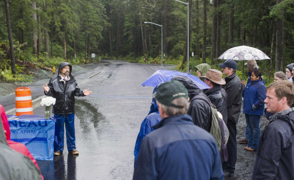 Lands and Resources Manager Greg Chaney speaks during a celebration of a new road to housing at the intersection of Jackie Street and Renninger Street, next to Dzantik'i Heeni Middle School, on Wednesday.