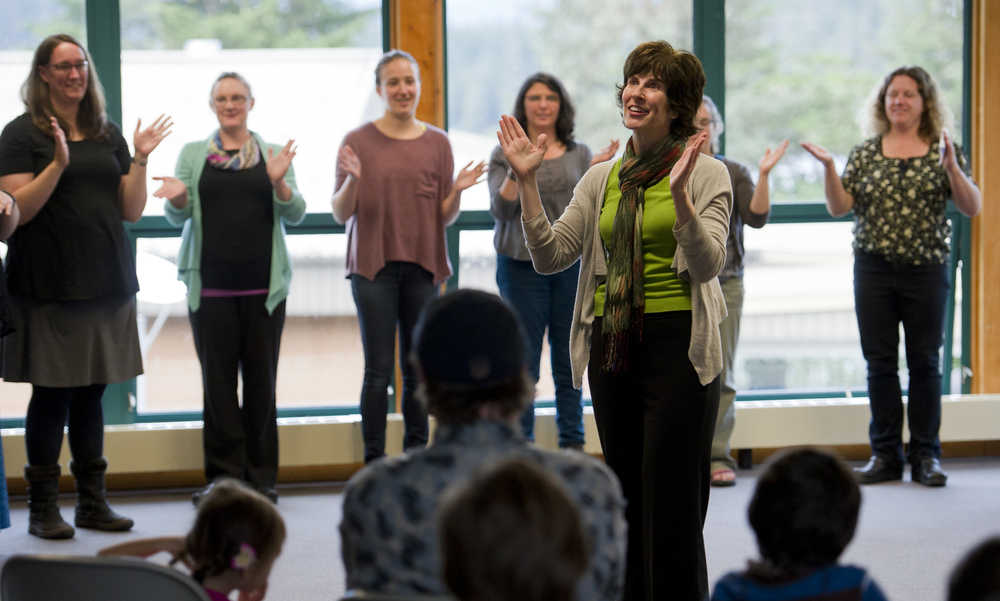 Institute faculty member Lorrie Heagy leads other teachers in a song at the University of Alaska Southeast on Thursday. The teachers were all part of the Juneau Basic Arts Institute, an annual two-week summer program during which educators and administrators learn how they can incorporate art into their classrooms on a daily basis.