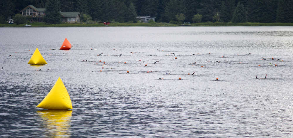 Participants swim in Auke Lake during the 8th annual Aukeman Sprint Triathlon at the University of Alaska Southeast on Saturday.