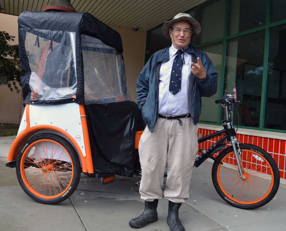 William Quayle Jr. stands beside his pedicab discussing what he plans to do if elected to the Juneau Assembly in October. Quayle mad his Assembly bid official on Friday after filing with the city election official.