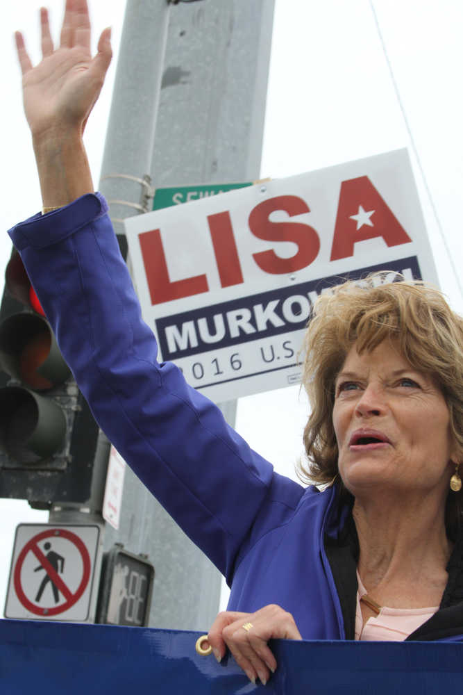 This Aug. 12, 2016, photo shows U.S. Sen. Lisa Murkowski, R-Alaska, campaigning at a busy street corner in Anchorage, Alaska. Murkowski is expected to win Tuesday's Republican primary, but has been campaigning hard after losing her 2010 primary race, only to come back and win re-election in a general election write-in bid. (AP Photo/Mark Thiessen)