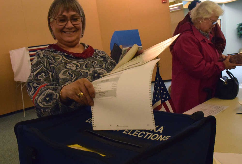 Barbara Taug casts an early vote Monday, Aug. 15, 2016 at the Mendenhall Mall. Alaska's statewide primary is Tuesday.