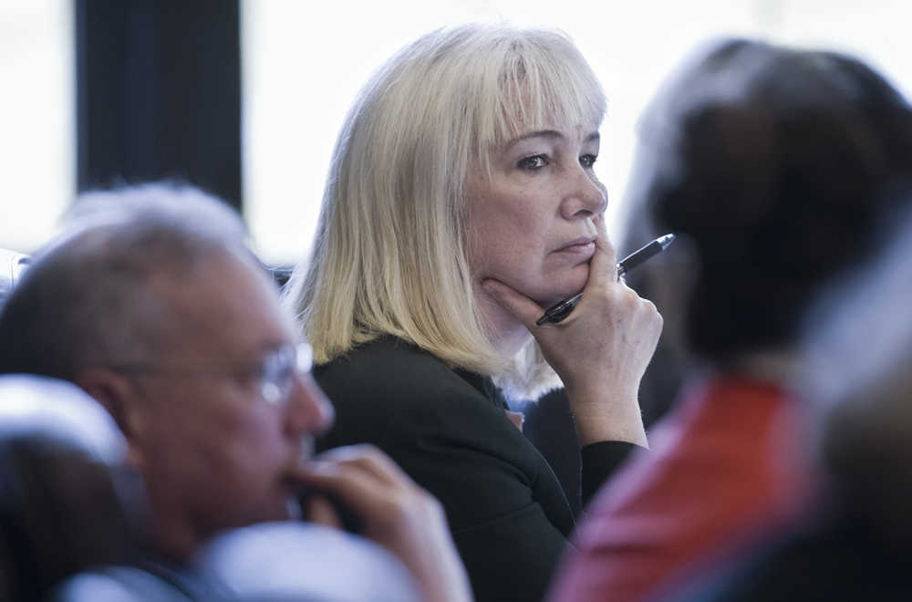 Rep. Cathy Muñoz, R-Juneau, listens to the introduction of HB 379 in the House Finance Committee at the Capitol on April 21. The bill would eliminate pay increases for certain state employees.