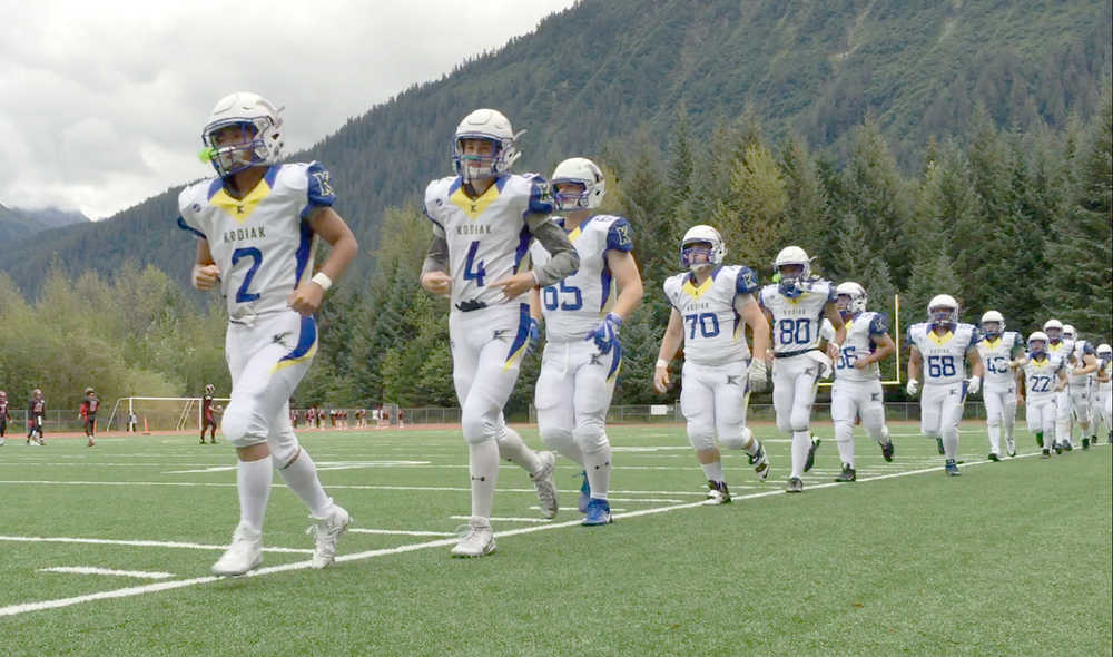 The Kodiak High School Bears take the field Friday prior to their game against Juneau-Douglas High School at Adair Kennedy Field. Kodiak won 26-20.