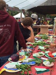 Johnson Youth Center youth stand by their prize winning vegetables.