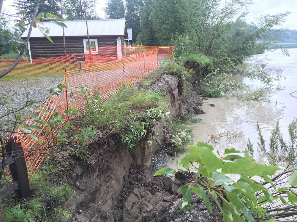This July 2016 photo provided by Alaska State Parks shows an old cabin at Big Delta State Historical Park 90 miles southeast of Fairbanks that was recently moved back 50 feet because of an eroding riverbank. The Alaska State Parks agency is turning to crowdfunding to raise money for erosion protection at the park.
