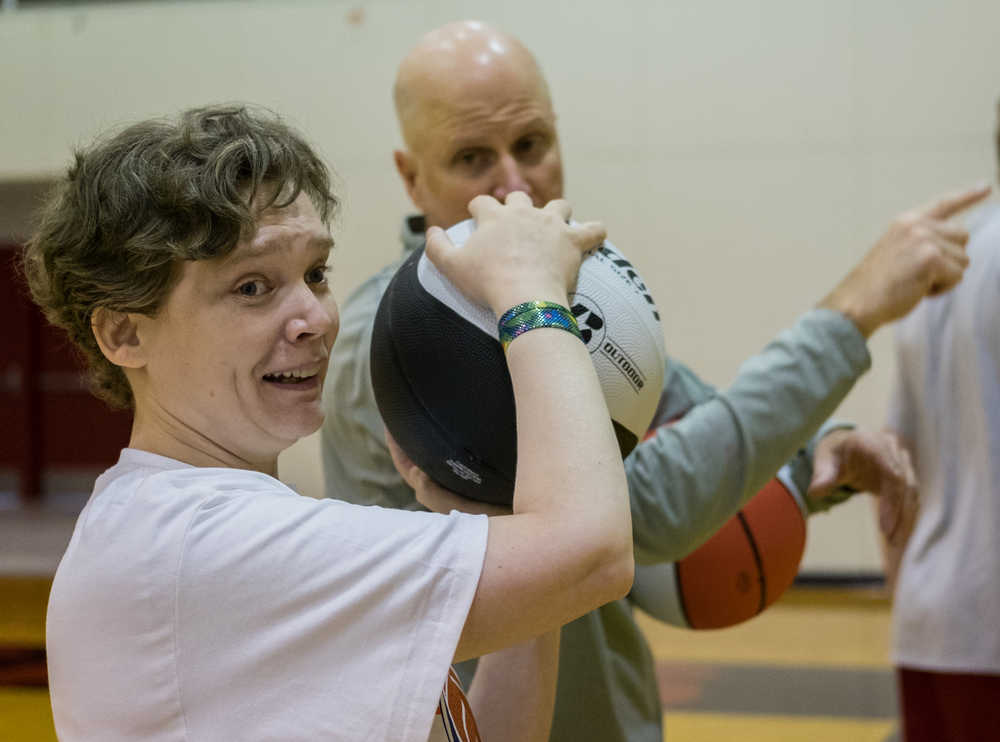 Tammi Birch a participant in this years "I Did. You Can." Basketball Camp for athletes with special needs shows off one of many smiles that were going on Saturday at JDHS Gymnasium.