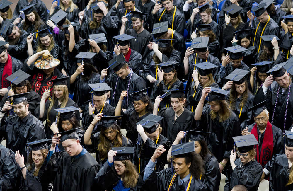 Graduates move their tassles from right to left during commencement for the University of Alaska Southeast the UAS Recreation Center in May 2015.