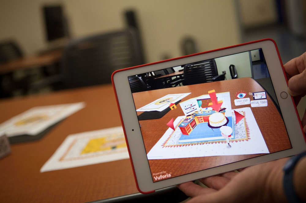 Dave Dannenberg, assistant professor of instructional technology at University of Alaska Anchorage, demonstrates Peronio, a digital children's pop-up book, which uses augmented reality in early childhood education.