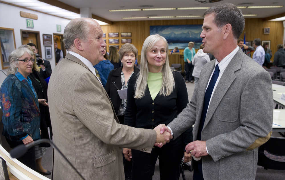 Gov. Bill Walker speaks with Juneau Assembly members Jerry Nankervis, right, Maria Gladziszewski, Mary Becker and Kate Troll, left, after a special meeting on Thursday.