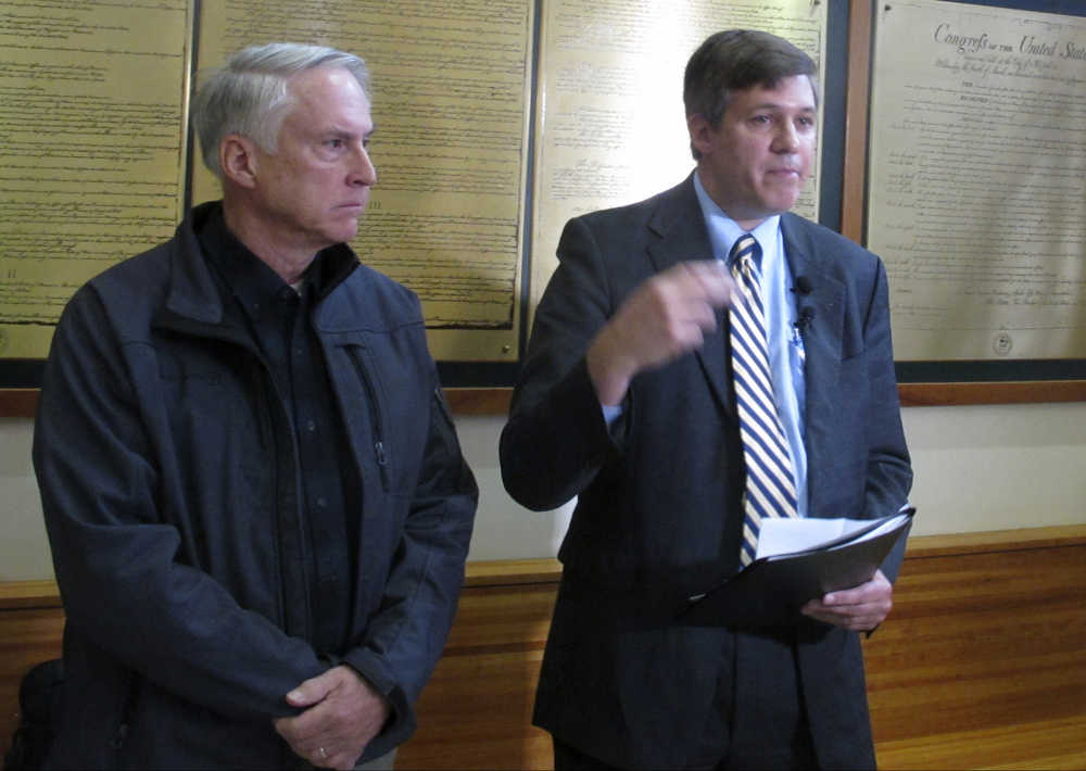 Former state Sen. Rick Halford, left, and current state Sen. Bill Wielechowski answer questions about a lawsuit they filed at a press conference on Friday, Sept. 16, 2016, in Anchorage, Alaska. The lawsuit filed by Wielechowski, Halford and former state Sen. Clem Tillion claims Gov. Bill Walker acted illegally in vetoing half the money designated for Alaska Permanent Fund dividends, the annual checks that give residents a share of the state's oil wealth. (AP Photo/Dan Joling)
