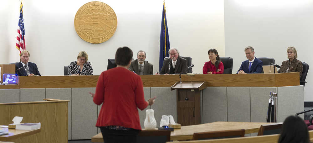 Member of the Alaska Judicial Council, including Chief Justice Craig Stowers, fourth from right, listen to Juneau Assistant District Attorney Amy Paige on Monday as the council takes public input for Juneau's new District Court judge opening.