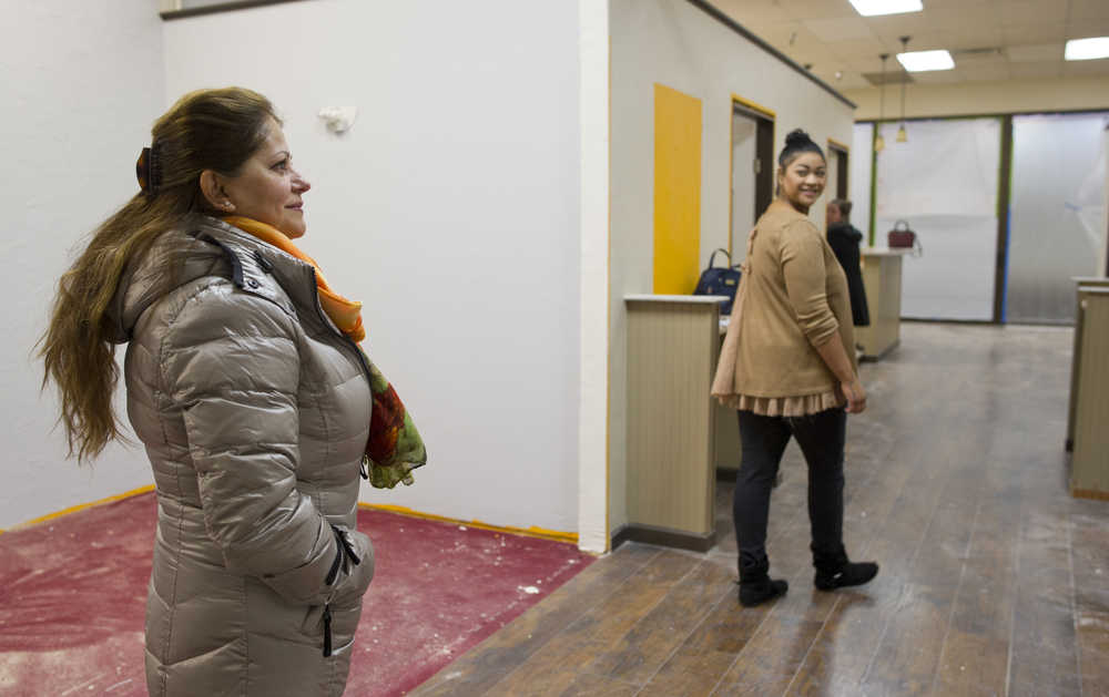 Owner Shamila Scalf, left, and associates LaShonda Cooper, center, and Amanda Mack view a new space in the Mendenhall Mall Thursday that they will convert into a new child care center.