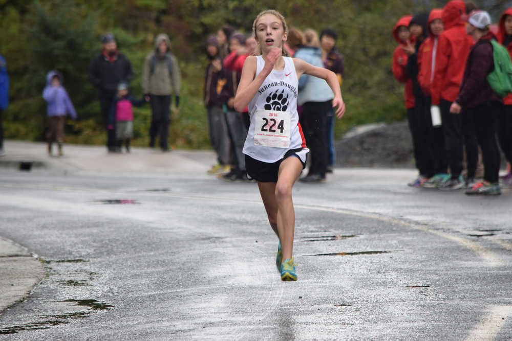 Juneau-Douglas High School freshman Anna Iverson sprints to the finish at the end of Saturday's Region V cross country championship in Sitka.