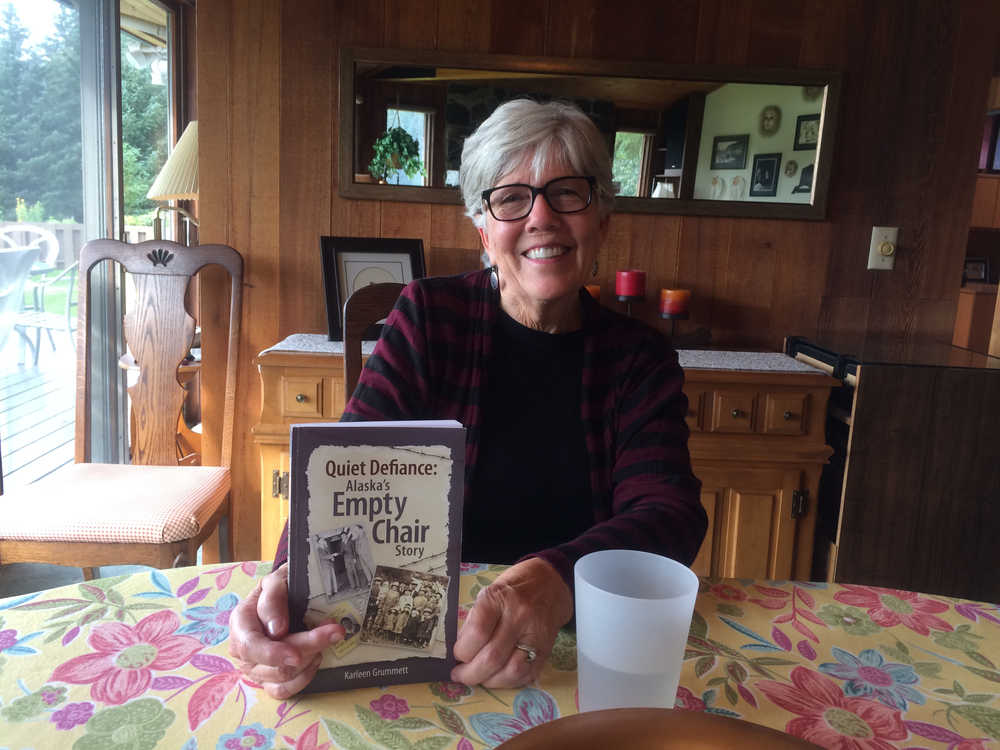 Karleen Grummett holds her soon to be released book "Quiet Defiance: Alaska's Empty Chair Story" which chronicles the history of the Japanese-Americans of Juneau who were incarcerated during World War Two and the community's response.
