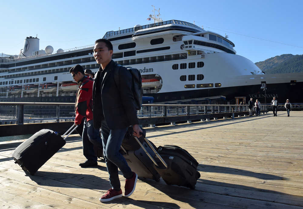 Passengers and crew debark the Holland America Line cruise ship Volendam on Saturday, Oct. 1, 2016 at the Port of Juneau. The Volendam is the last cruise ship of the 2016 tourist season to stop in Juneau. More than 1 million passengers passed through the port this year.