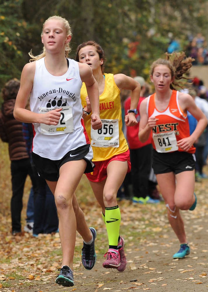 Eventual winner Sadie Tuckwood, from Juneau-Douglas, leads Kendall Kramer, from West Valley, and Molly Gellert, from West High, on the first lap in the 4A girls state cross county championship race at Bartlett High School in Anchorage, Alaska on Saturday, October 1, 2016. (Bob Hallinen / Alaska Dispatch News)
