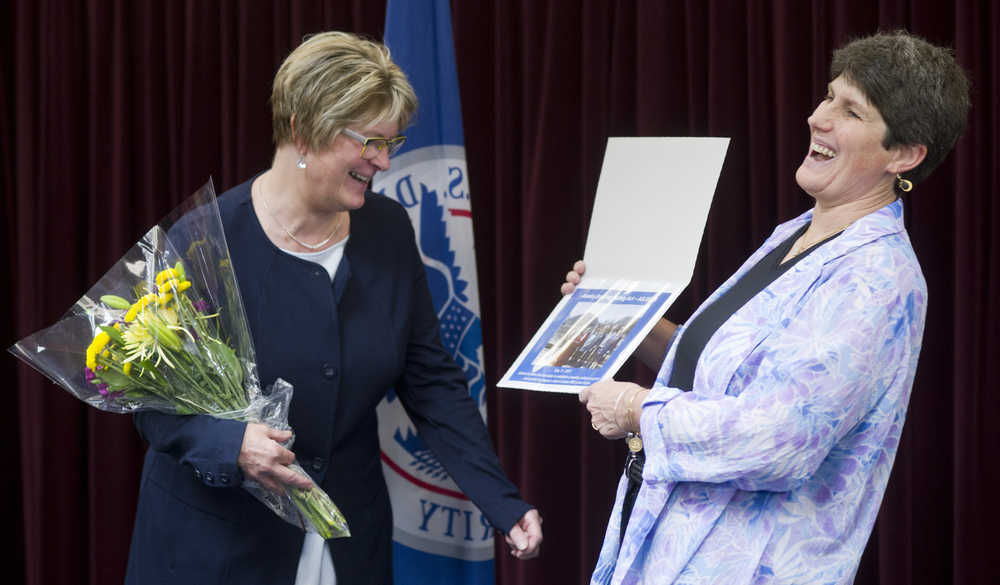 Beth Kerttula, left, and Sudie Hargis share a laugh during an award ceremony at District 17 headquarters in the Federal Building on Friday. Hargis as given the Commander's Award for Civilian Service for her work while assigned as the Tribal Liaison Speciallist for District 17 since 2012. Hargis is retiring from the Coast Guard after serving as an active duty officer from 1887 to 1994, and numerous other positions as a civilian. Former Rep. Kerttula was presented the Coast Guard Distinguished Public Service Award for outstanding service as Director of the National Ocean Council from May 2014 to June 2016.