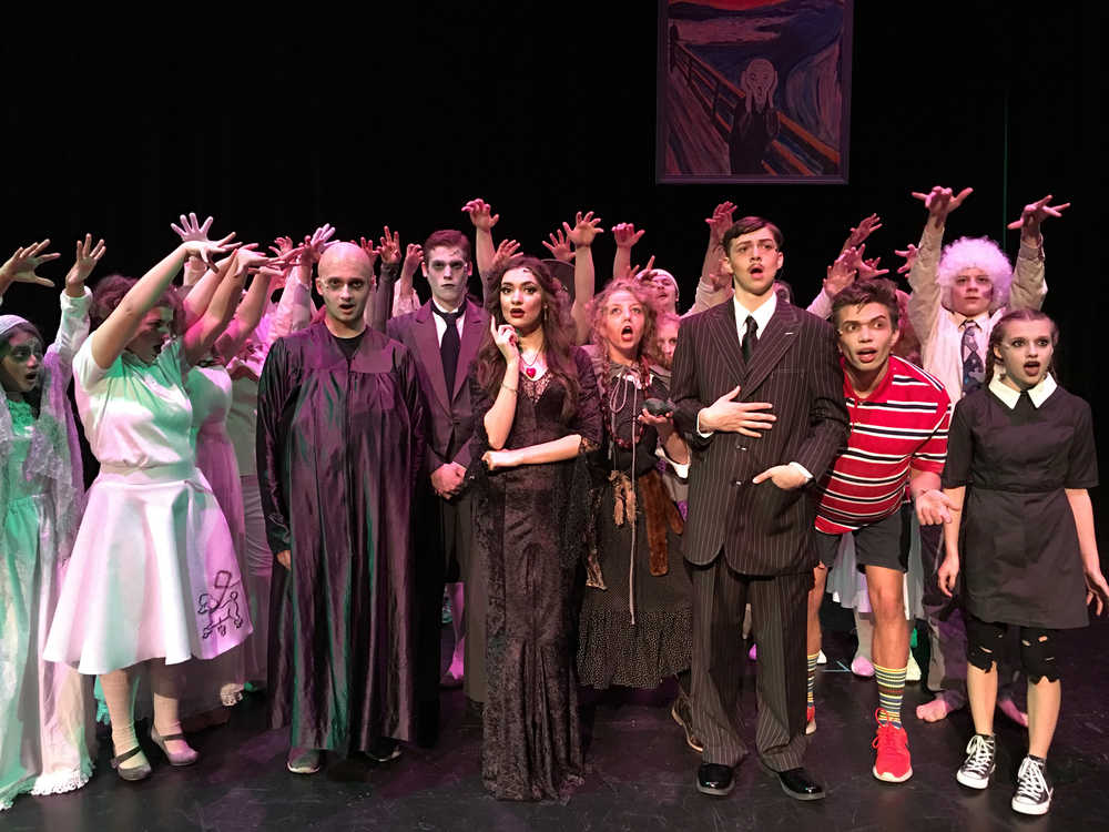 The cast of The Addams Family, a one-weekend-only musical put on by Juneau-Douglas High School. In the play, Wednesday Addams is engaged - to a boy from a "normal" family. As the Addams family hosts a meet and greet dinner between the two families, hilarity ensues.