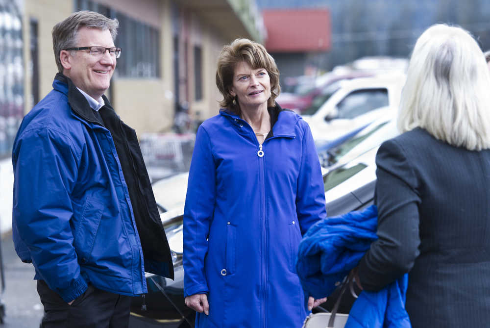 Tyler Myers, president of The Myers Group which owns Super Bear and IGA Foodland, left, talks with U.S. Sen. Lisa Murkowski, center, and Rep. Cathy Muñoz, R-Juneau, after the candidates met with shoppers at Super Bear on Monday.