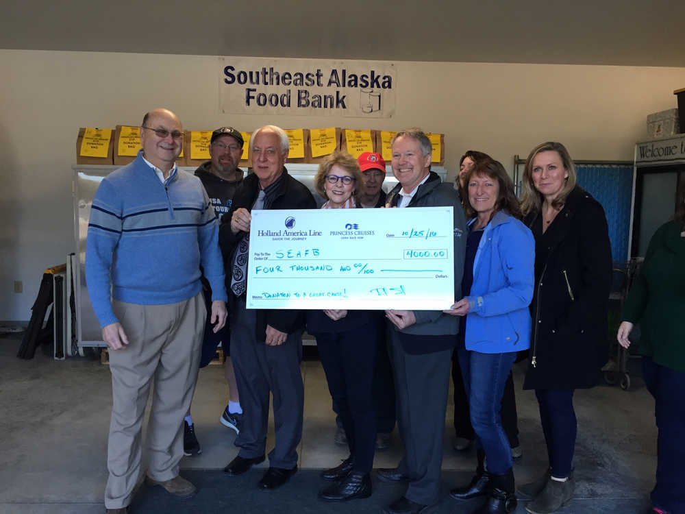 Holland America presents a check for $4,000 to Southeast Alaska Food Bank.