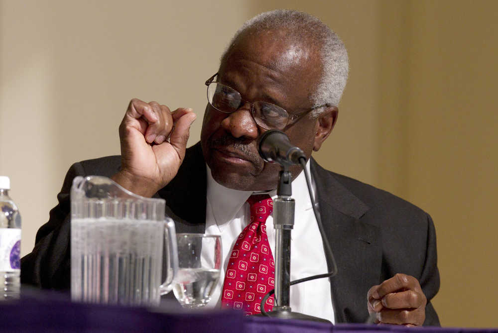 FILE - In this Jan. 26, 2012 file photo, Supreme Court Justice Clarence Thomas speaks at College of the Holy Cross in Worcester, Mass. Thomas says the Supreme Court confirmation process is an example of how the nation's capital is "broken in some ways." Thomas reflected Oct. 26, 2016, on his 25 years as a justice, at the Heritage Foundation, the conservative think tank where his wife once worked. (AP Photo/Michael Dwyer, File)