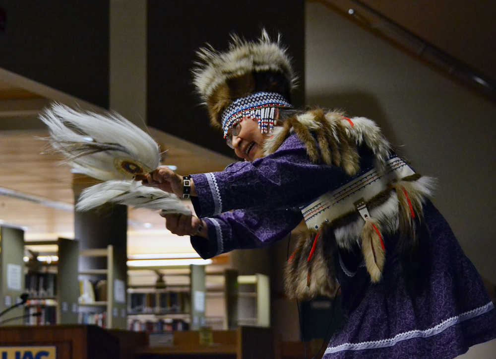 Theresa Arevgaq John, a professor at the University of Alaska Fairbanks, performs a Yup'ik dance during a lecture in the Egan Library at the University of Alaska Southeast Friday night. In her lecture - a part of the Evenings at Egan series - John discussed what it was like to grow up straddling two cultures, one Native and the other Western.