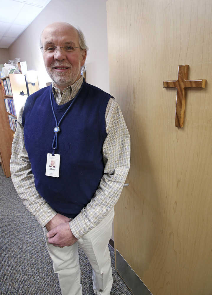 In this Oct. 25 photo, Hospice Services for Fairbanks Memorial Hospital Chaplin David Rumph poses for photos in his office in Fairbanks.